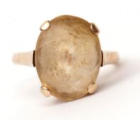 Modern yellow metal and lemon citrine ring, the oval faceted citrine, four claw set and raised in
