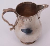 Elizabeth II sparrowbeak jug of typical baluster form with applied spout and C-scroll handle on