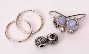 Three boxes Pandora items to include a pair of hooped earrings, bead earrings with Sterling