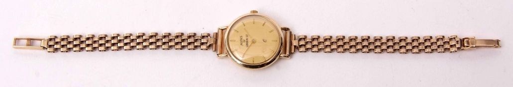 Late 20th century 9kt ladies wrist watch, the movement (unseen) to a signed gilt circular dial in