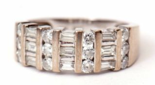 Precious metal and diamond cluster ring, alternate set with bands of small circular cut baguette