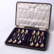 Cased set of twelve Hanoverian rat-tail pattern coffee spoons together with matching sugar tongs,