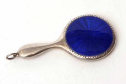 Electro-plated and enamelled novelty hand mirror of polished form with circular translucent blue