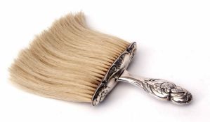 Edward VII silver handled dressing table powder brush, the silver mount and handle decorated with