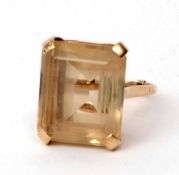 9ct stamped citrine dress ring, the large stepped cut citrine 20 x 40mm, raised in a basket