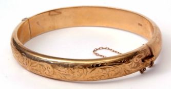 9ct gold hinged bracelet, part engraved with a foliate design, hallmarked Chester 1959, makers
