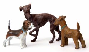 Three cold painted bronze models of dogs, including a whippet, terrier and hound, tallest 7cms (3)
