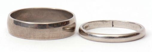 Mixed Lot: Platinum band, 2.6gms, together with a metal wedding ring (2)