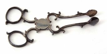 Pair of 18th century sugar nips of cast C-scroll construction with ring handles and plain shell