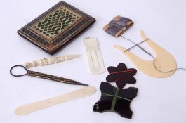 Mixed Lot: of sewing related items including an ivory lucet, darning needle holder, bone spatula,