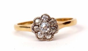 Precious metal and diamond cluster ring, featuring 7 old cut diamonds in a flowerhead design, size