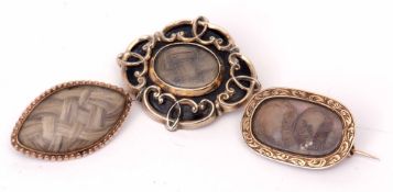 Mixed Lot: three 19th century mourning brooches, a black enamel and plaited hair brooch, a lozenge
