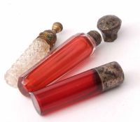 Mixed Lot: three various scent bottles, the first of plain cylindrical ruby glass form with screw