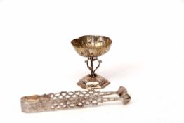 Pair of 18th century cast arm sugar tongs (damaged and repaired), together with a small lobed goblet
