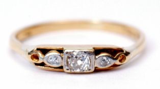 Precious metal three-stone diamond ring, the centre old cut diamond, 0.05ct approx, flanked by 2