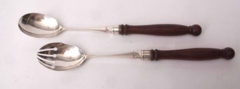 Pair of Edward VII silver and teak handled salad servers of plain polished form with baluster turned