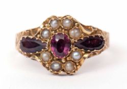 Late Victorian 15ct gold purple coloured paste and seed pearl cluster ring, a design with a