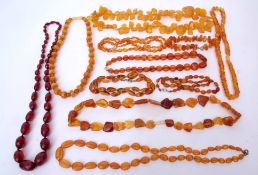 Mixed Lot: ten modern Bakelite amber coloured necklaces and one bracelet