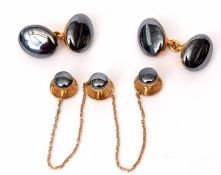 Cased part gent's dress set having polished haematite centre stones, the verso each stamped 18ct
