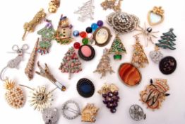 Quantity of costume jewellery, mainly brooches, to include Butler & Wilson monogrammed brooch,