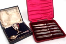 Mixed Lot: cased hallmarked silver egg cup and spoon together with a cased set of five (of six)