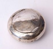 George V tobacco pebble of engine turned circular form with hinged cover and applied thumb piece and