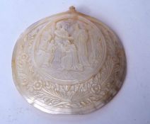 Carved mother of pearl shell with central panel depicting the three Wise Men arriving at the manger,