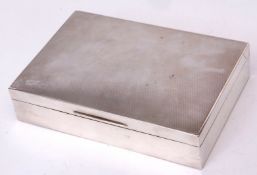 George VI table cigarette box of hinged rectangular form with engine turned cover and polished