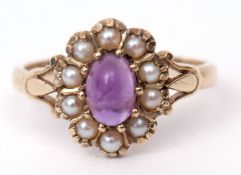 Modern 9ct gold amethyst and seed pearl cluster ring, the oval shaped cabochon amethyst set within a