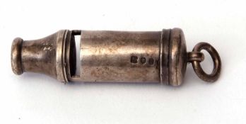 Victorian pea-whistle of cylindrical form with ring suspension and bearing contemporary crest and