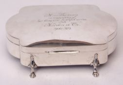 George V presentation inscribed dressing table casket of shaped rectangular form, hinged and