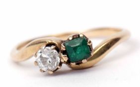 Emerald and diamond cross-over ring, featuring an old cut diamond, 0.15ct approx, and a small