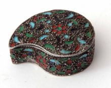 White metal and enamelled pill box of tear drop form with hinged cover and coloured enamel detail,