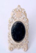 Late 19th century French ivory dressing table mirror of easel backed form, the mount with carved