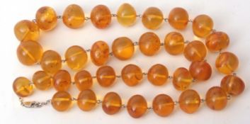 Vintage amber bead necklace, graduated row of beads, 6mm to 18mm, to a white metal chain and