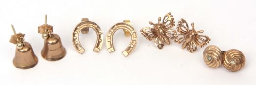 Mixed Lot: four pairs of 9ct gold earrings, a butterfly example, bell, horseshoe and knot designs,