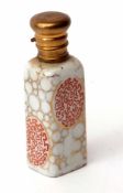 Late 19th century perfume flask, the rectangular porcelain body with gilt highlights to a gilt metal