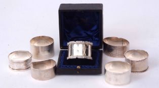 Mixed Lot: seven various napkin rings including six of cylindrical form and a seventh of oval