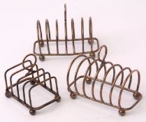 Mixed Lot: two of electro-plated six-slice toast racks of wire work construction and retailed by