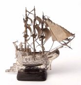 Continental white metal model of a three-masted sailing ship, stamped 930 and with further character