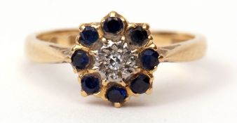 Diamond and sapphire cluster ring, the small centre diamond within a surround of 8 small sapphire in