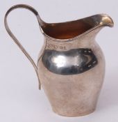 George V cream jug of helmet form with gilt lined interior, applied reeded rim and handle, height