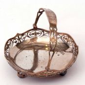 George V swing handled bon-bon dish of polished circular form with pierced gallery and hinged handle