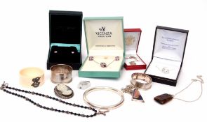 Box to include two hallmarked silver serviette rings, 925 stamped hollow bangle, hardstone cameo