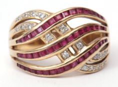 Precious metal ruby and diamond stylised ring having three bands of small pave set rubies (one