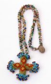 Vintage beaded cross pendant suspended from a multi-coloured small bead chain, 40 x 40mm