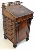 Victorian walnut Davenport with spindle gallery back fitted on one side with pen and ink tray over