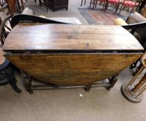 18th century and later oak gate leg table, frieze drawer to one end and raised on bobbin turned