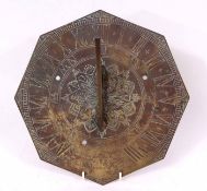 Late 19th century brass sundial of octagonal form with outer chapter ring with engraved Roman