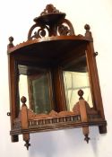 Late 19th century mahogany mirror back wall bracket, 70cms high